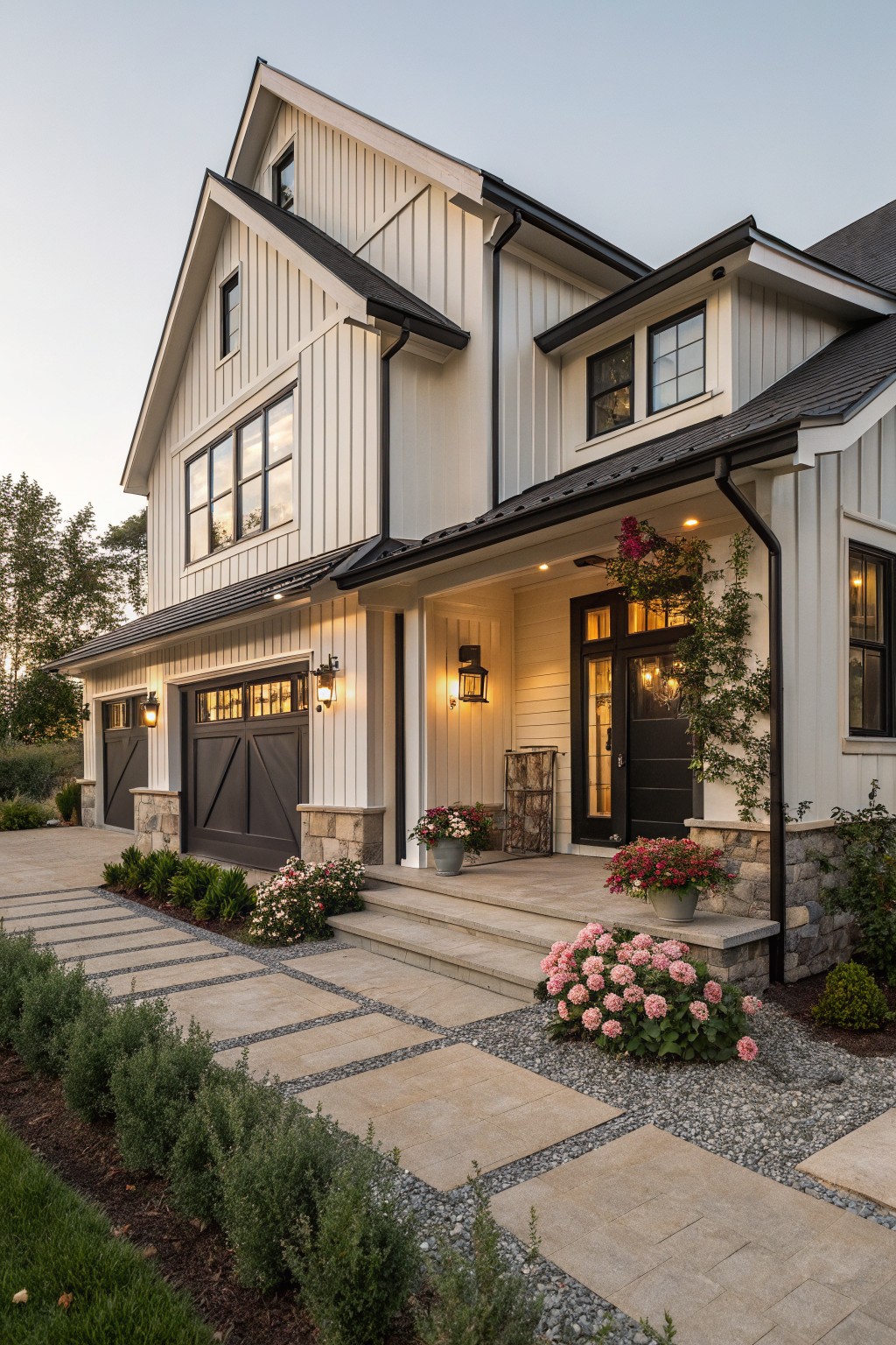 Modern farmhouse with stone accents, black trim, and lush pink flowers.