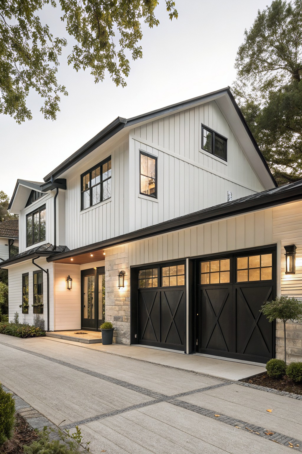 White shiplap-sided modern farmhouse exterior with black X-brace double garage doors, stone entry accents, and a concrete driveway.