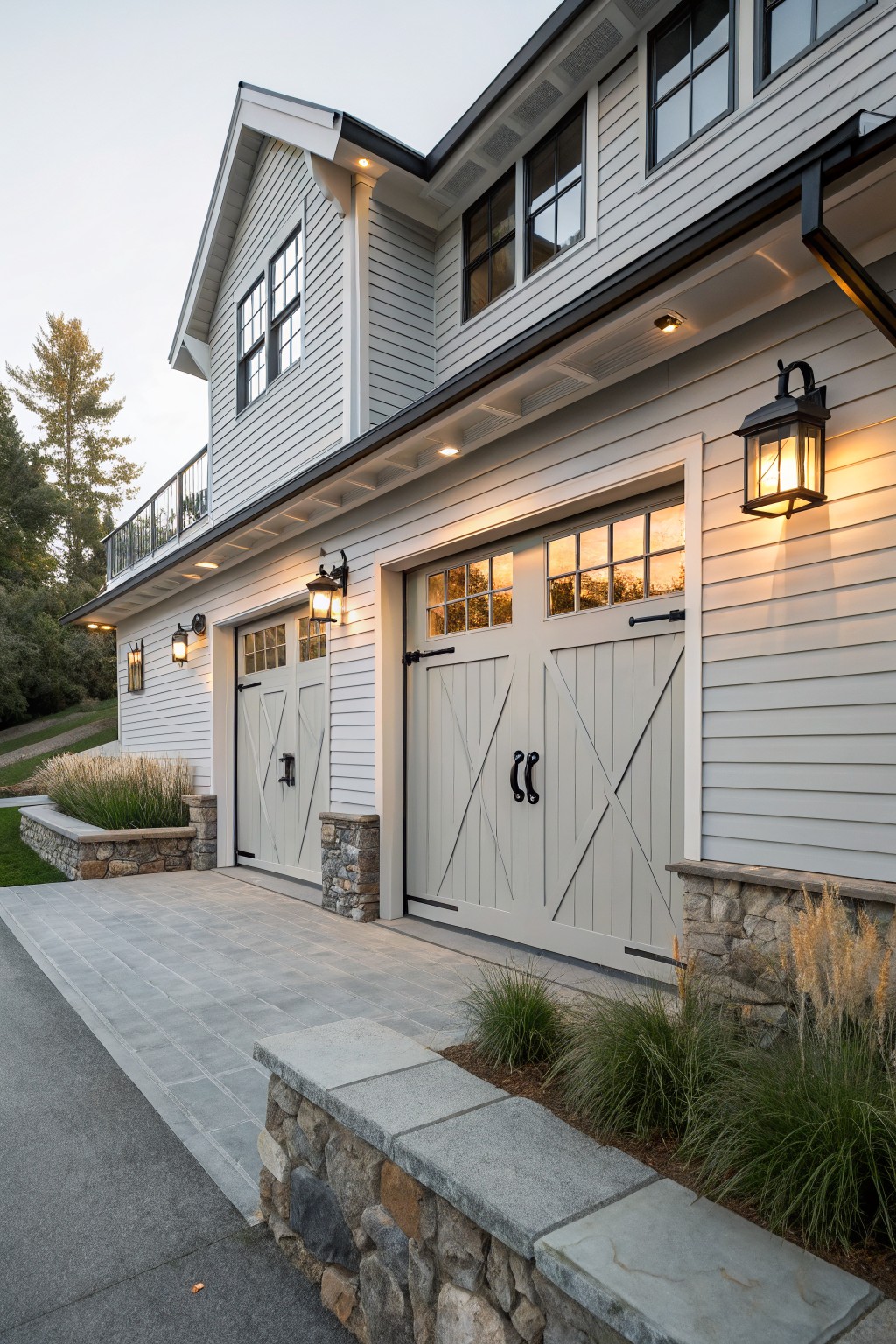 Modern two-story house with white siding and two beige garage doors.