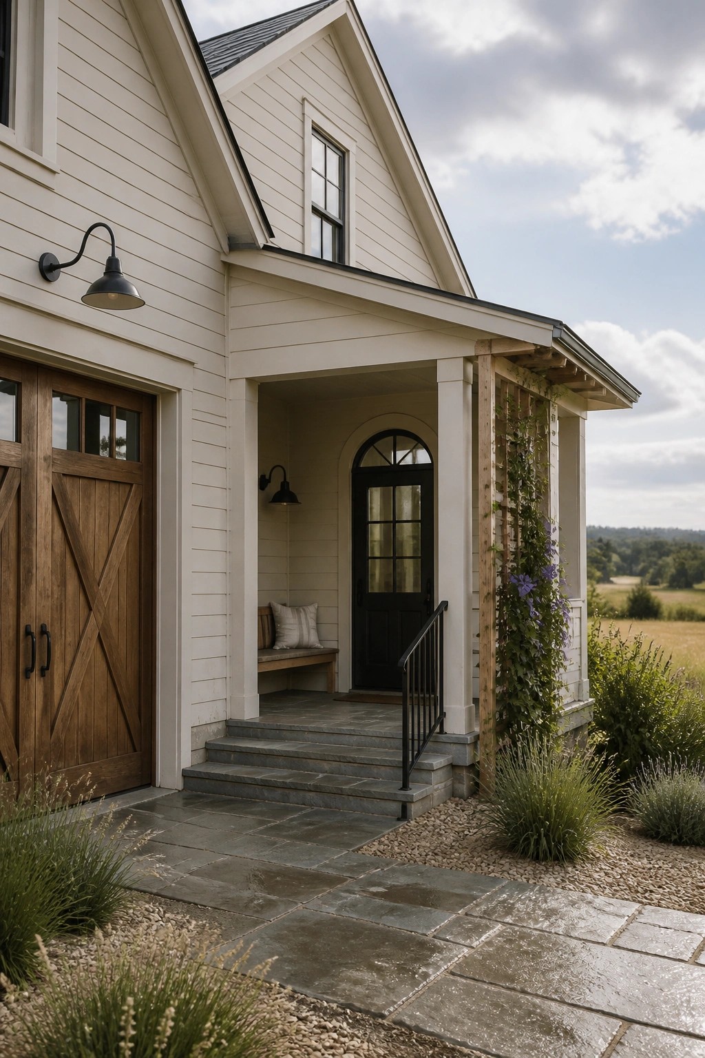 A farmhouse exterior painted in warm cream siding with a stone porch.