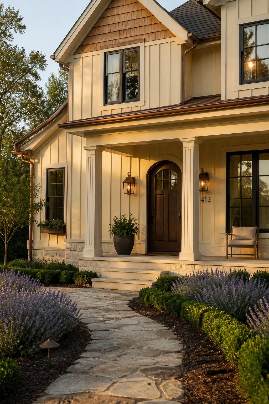 Warm cream siding on a modern farmhouse exterior with stone accents.