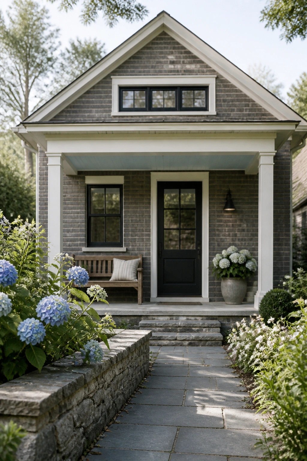 A modern farmhouse exterior with dark charcoal gray siding and white trim.