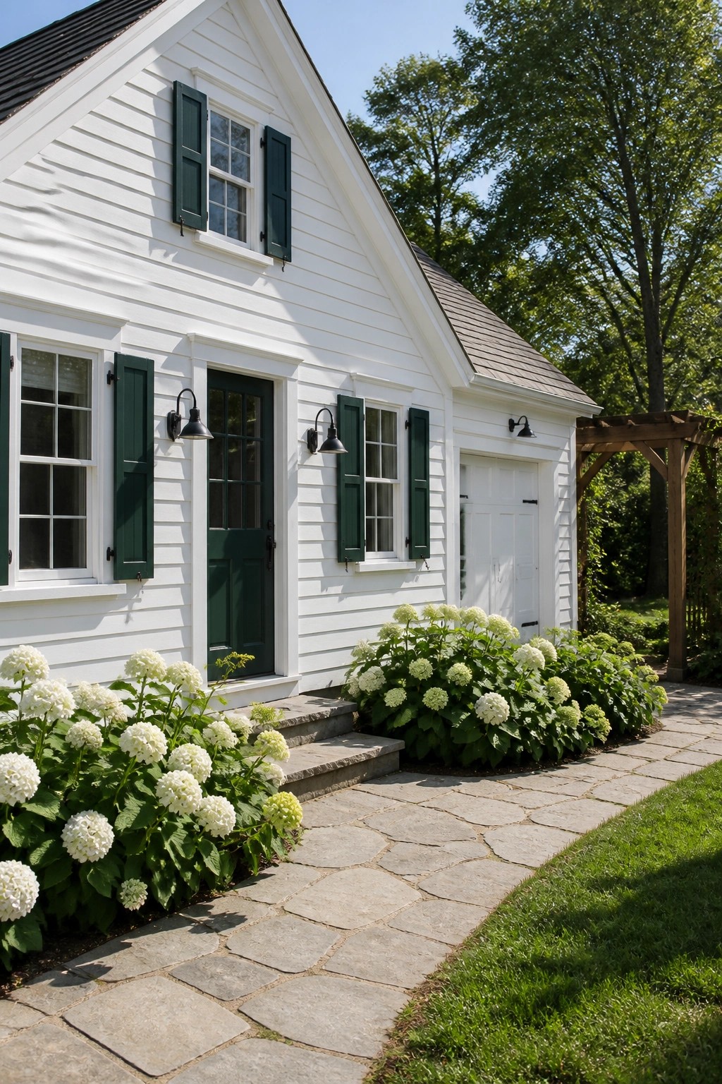 A small white farmhouse with dark shutters and a stone path in front.