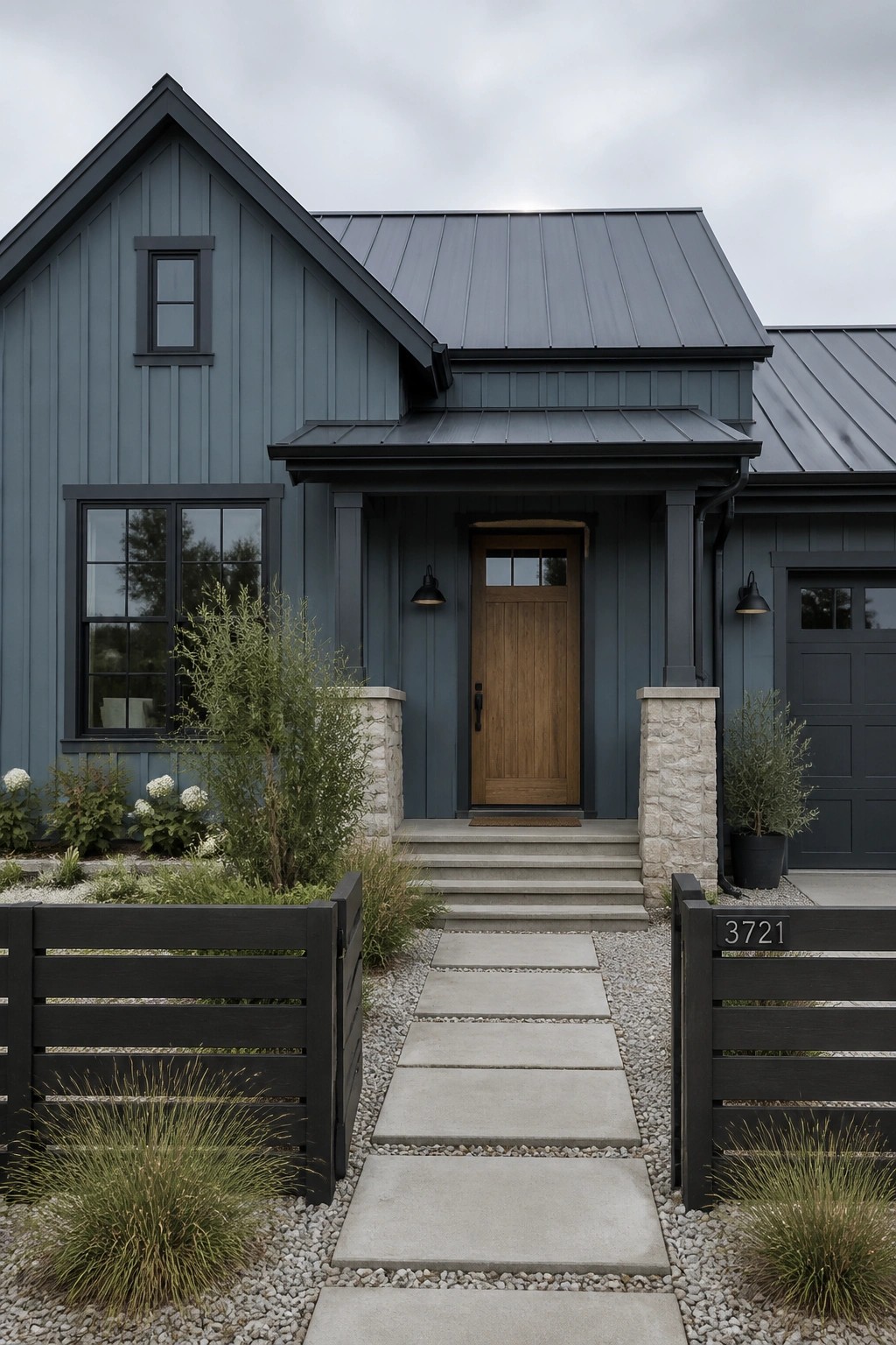 Modern farmhouse exterior with blue gray siding and a wooden front door.