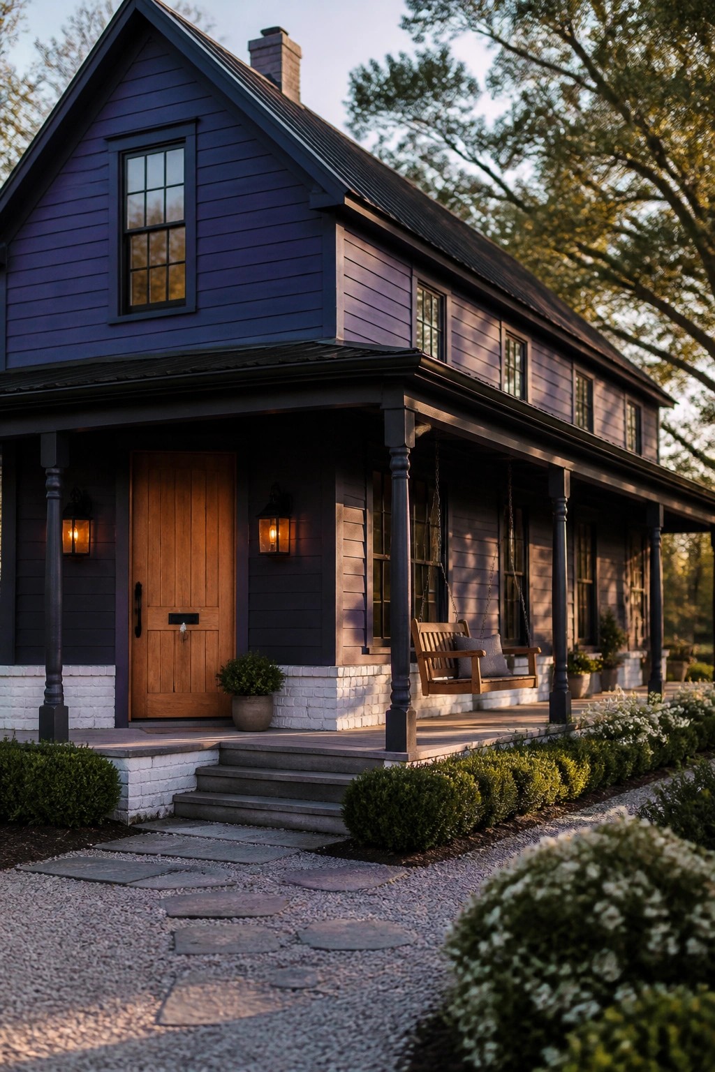 A farmhouse exterior painted in deep navy blue siding.