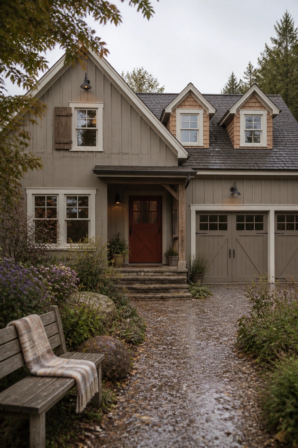 A rustic farmhouse exterior with soft greige siding and white trim.