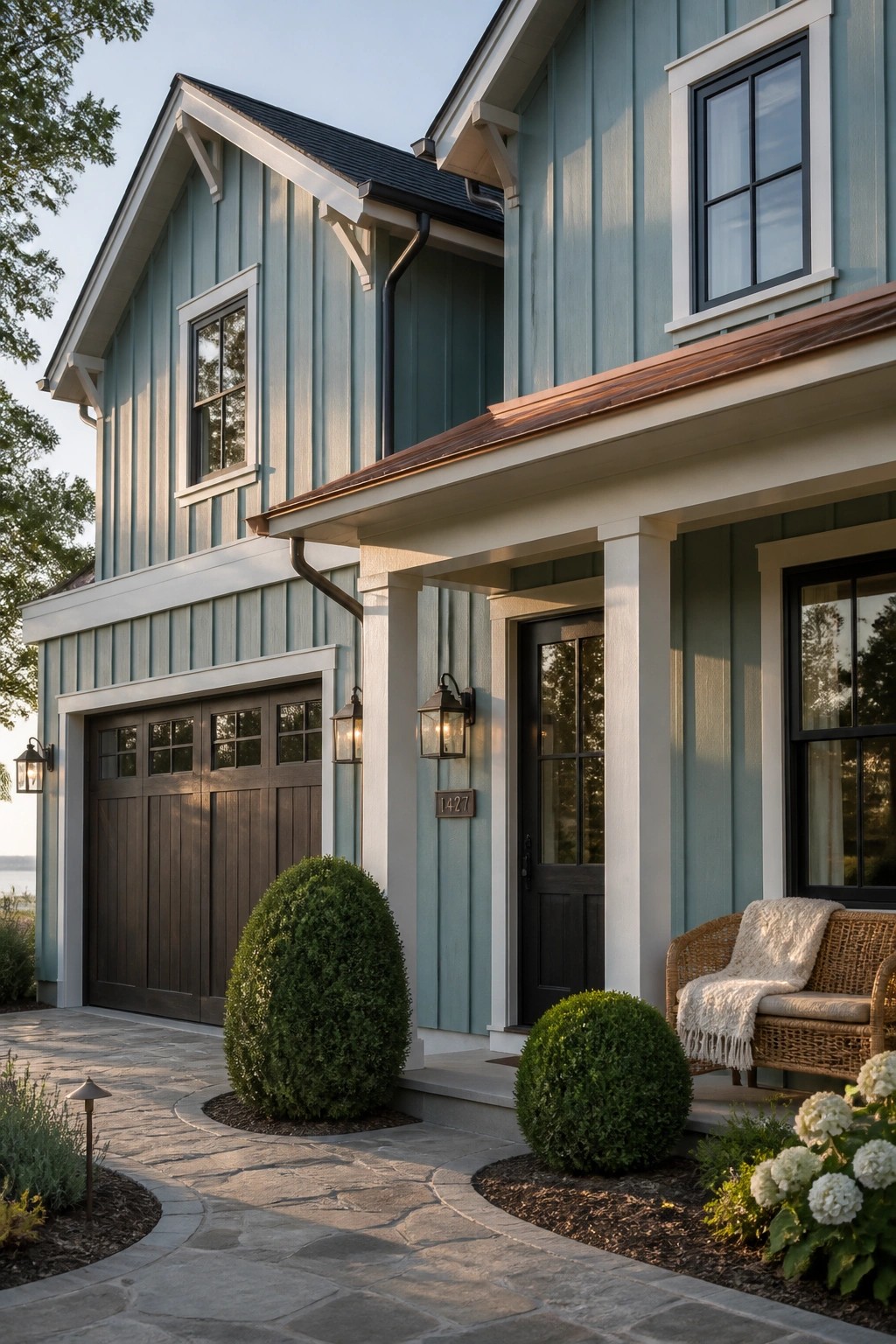 Light blue green siding on a modern farmhouse exterior.