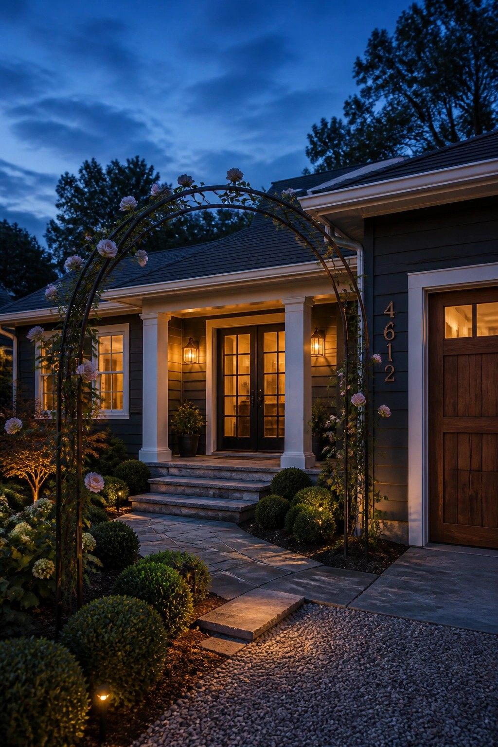 Dark charcoal gray siding on a ranch house with white trim and columns.