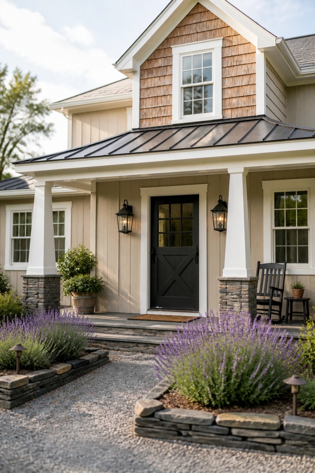 Beige farmhouse siding with white trim and stone details.