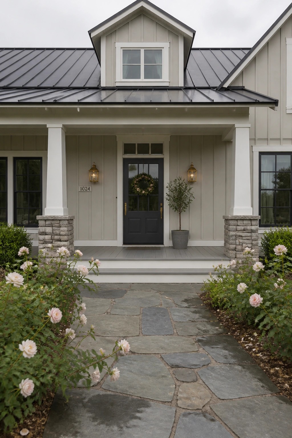 Farmhouse exterior with light greige siding and dark roofing.
