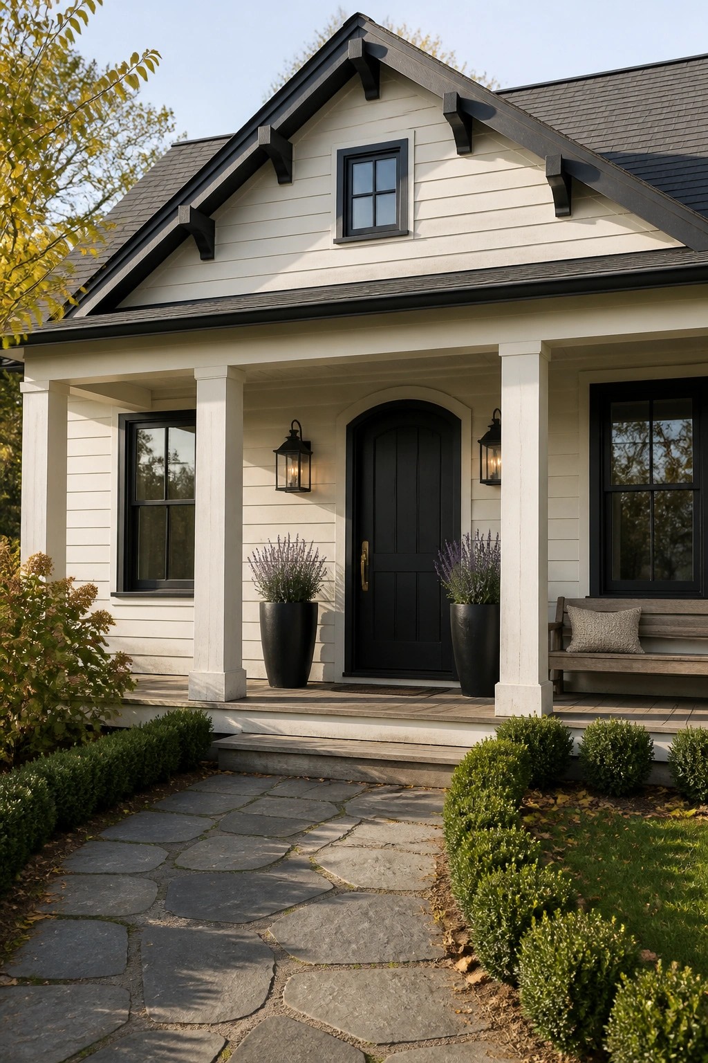 Creamy white siding on a modern farmhouse with black trim and windows.