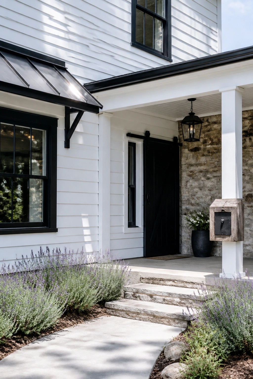 White house siding with black trim on a modern farmhouse exterior.