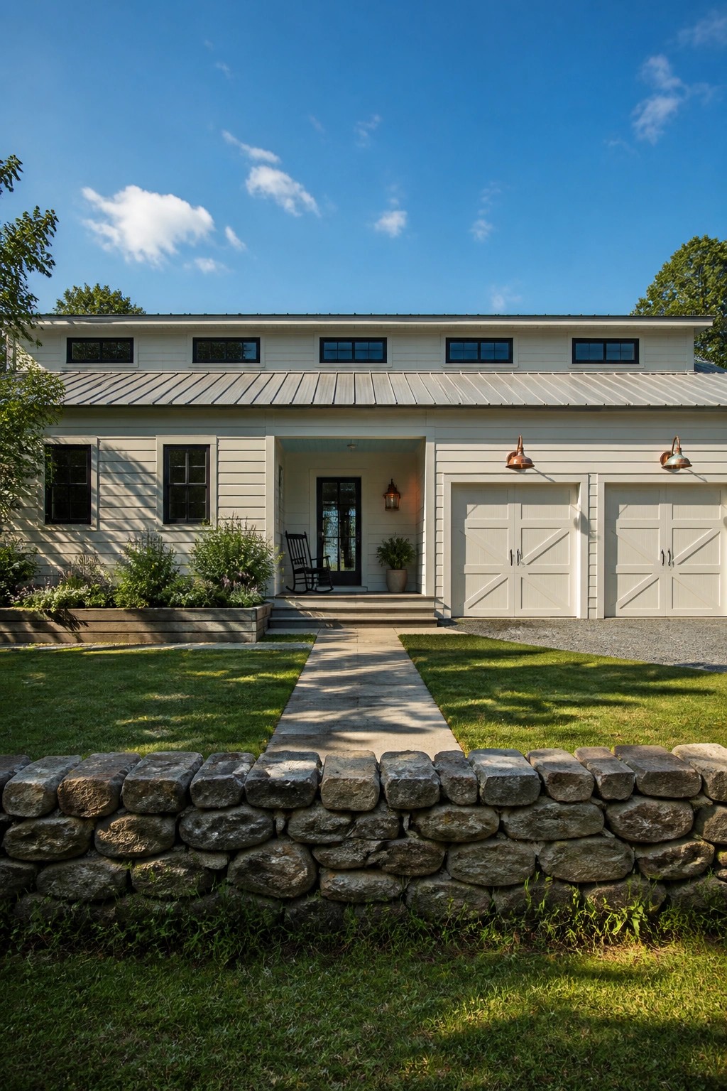 Light off-white siding on a modern farmhouse exterior with two garage doors.