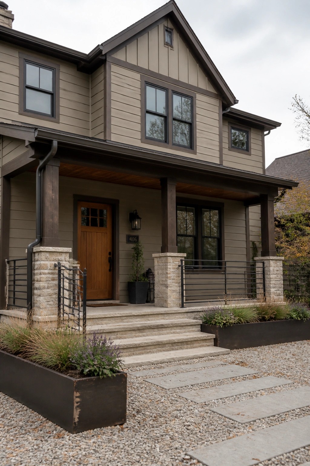Modern farmhouse exterior with warm greige siding and dark trim.
