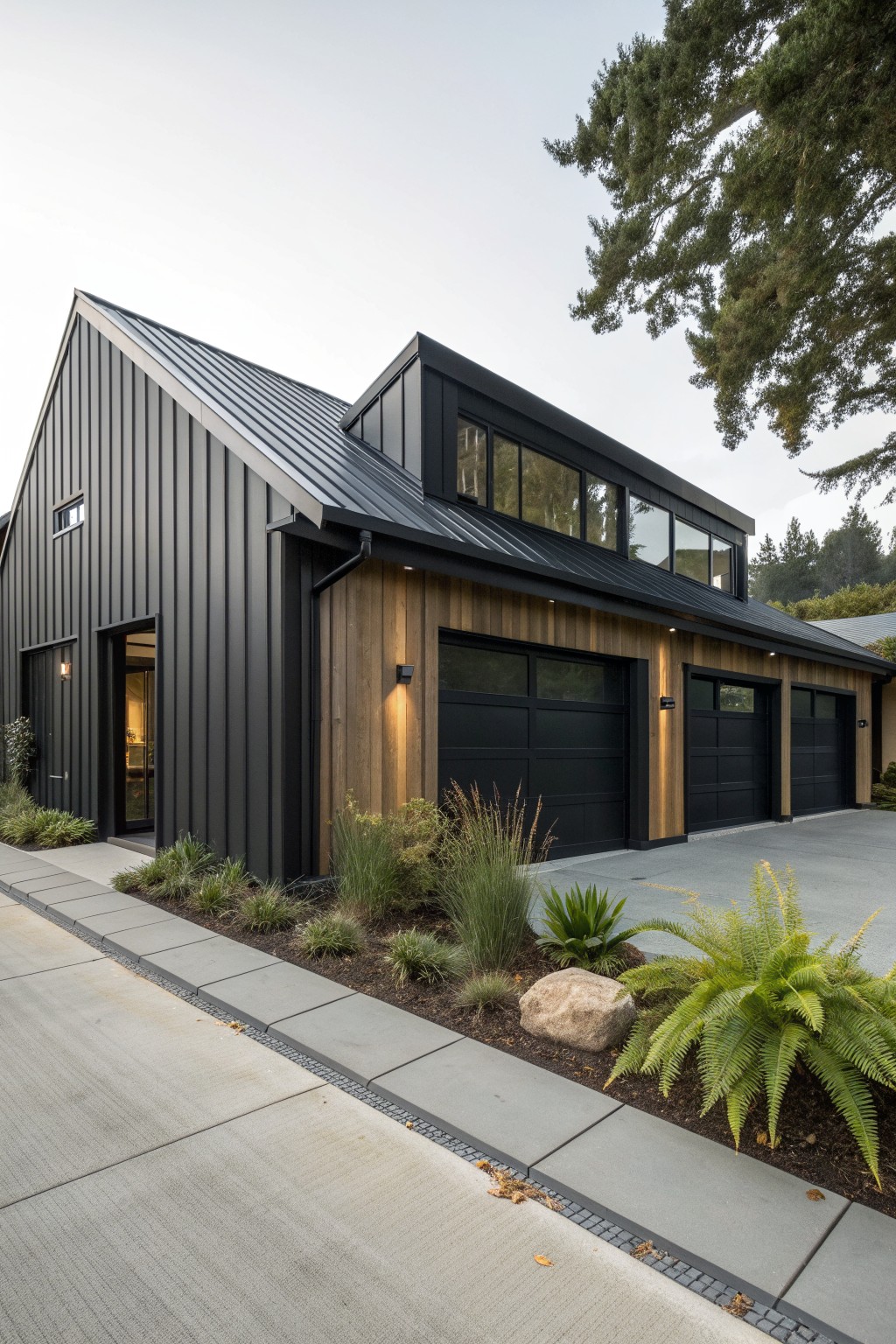 A modern ranch house with vertical black metal siding, wood panel accents around the garage doors, and a paved driveway with front landscaping.