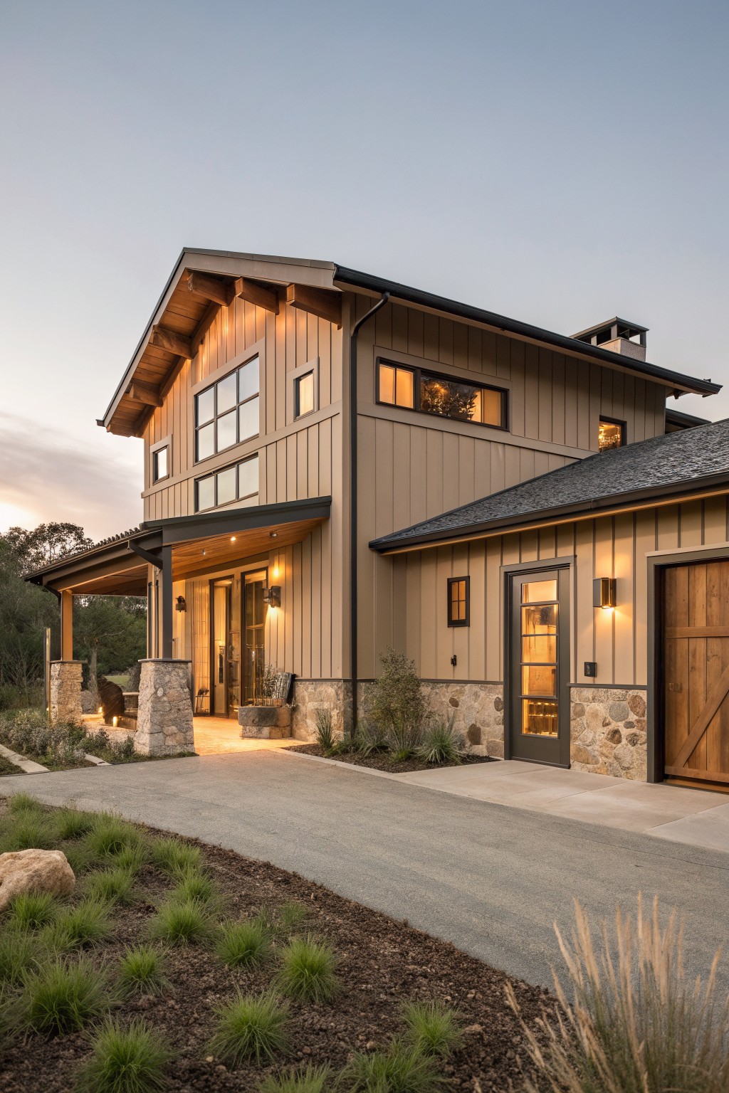 A two-story modern farmhouse with vertical wood siding, stone accents at the base, a covered entry, and a concrete driveway.