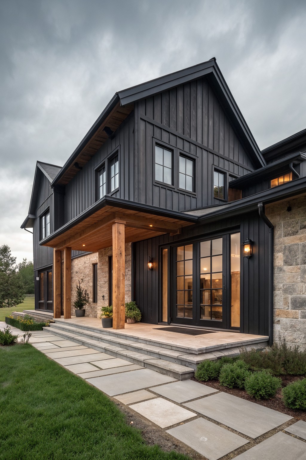Modern black house with wooden porch pillars, stone accents, and stone walkway entrance