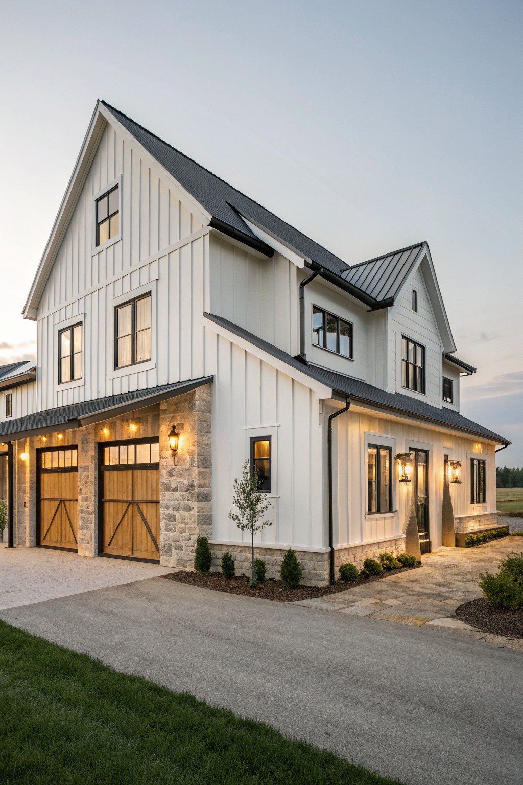 Modern white farmhouse with black roof, stone accents, and wooden garage doors