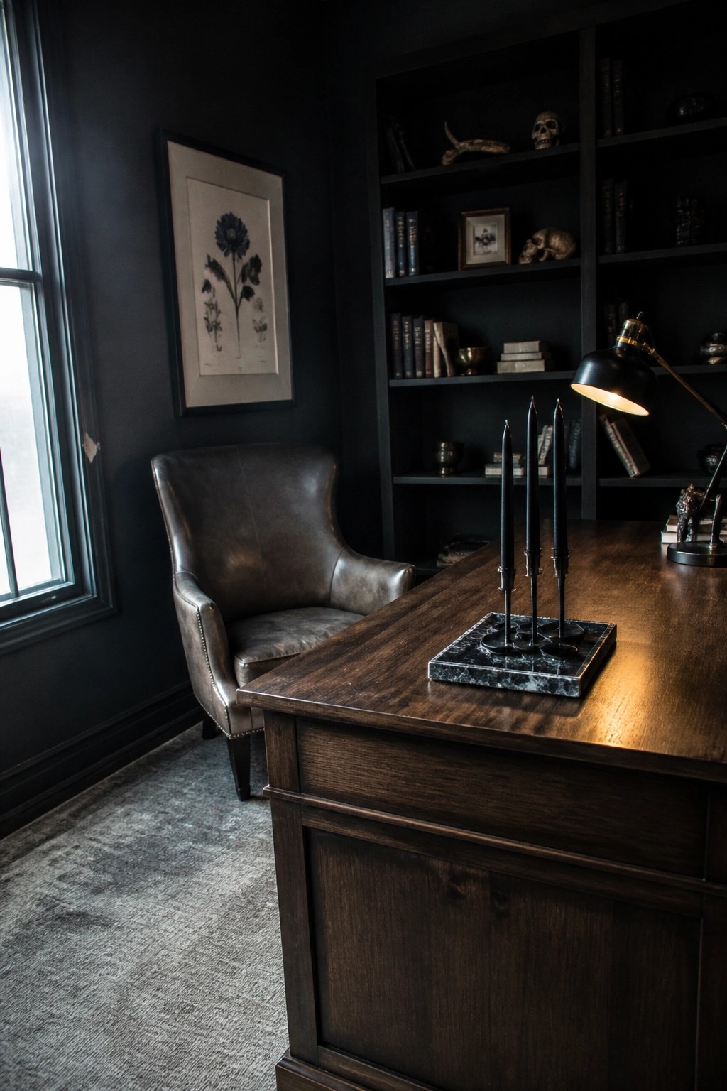 Dark wooden desk with black candles, leather chair, and bookshelves in moody study.