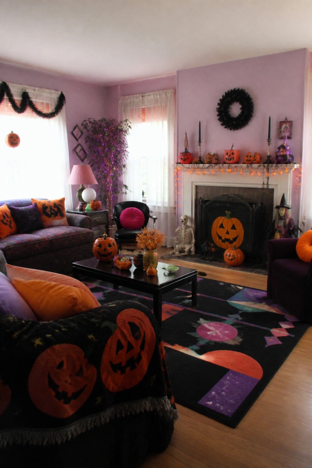 Living room mantel decorated with multiple jack o lanterns, orange string lights, black candles, and a black wreath above the fireplace.